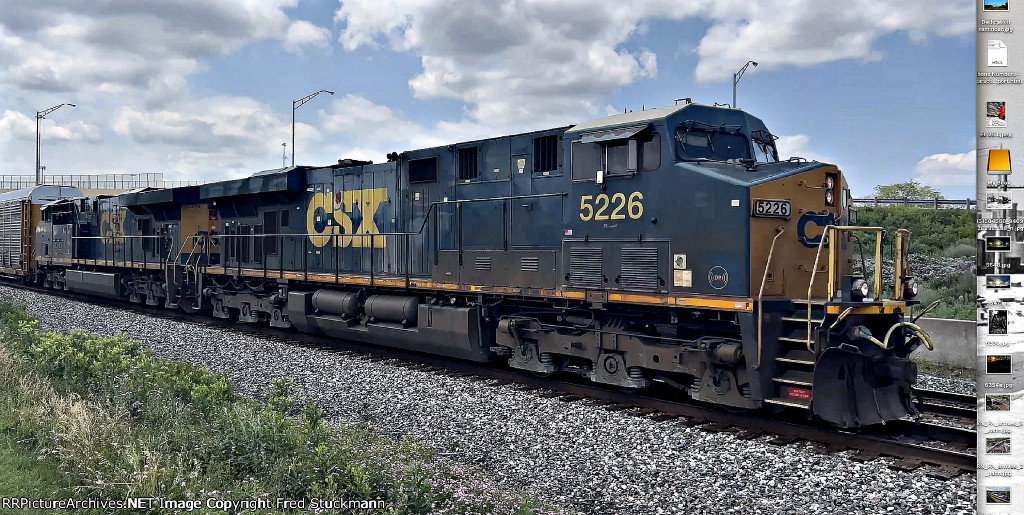 CSX 5226 leads another M214.